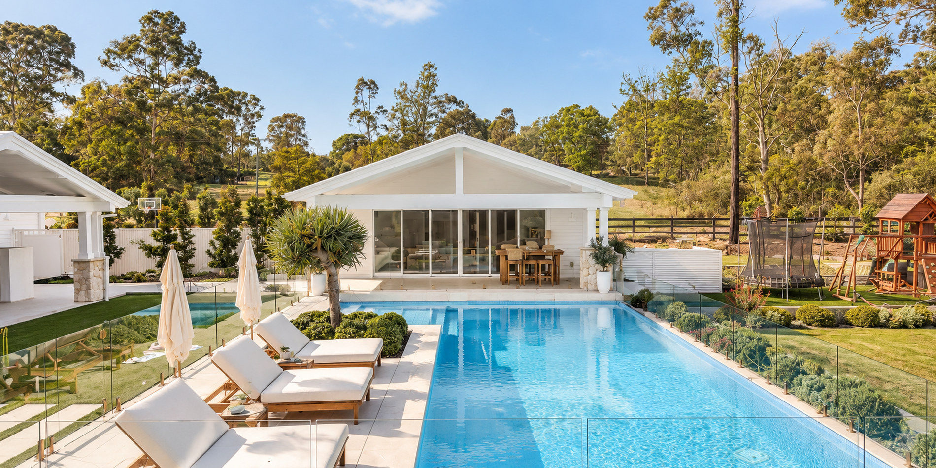 Pool, loungers and the glazed cabana