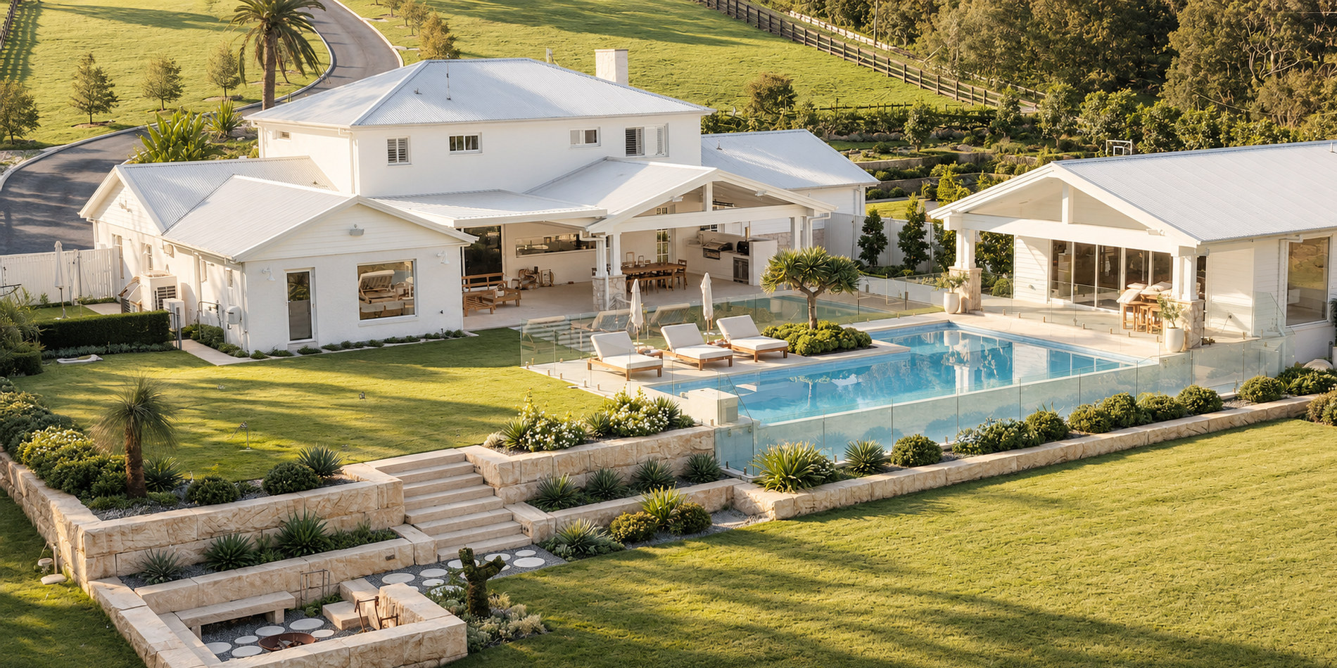 The whole property from the air — pool, putting green and lawn