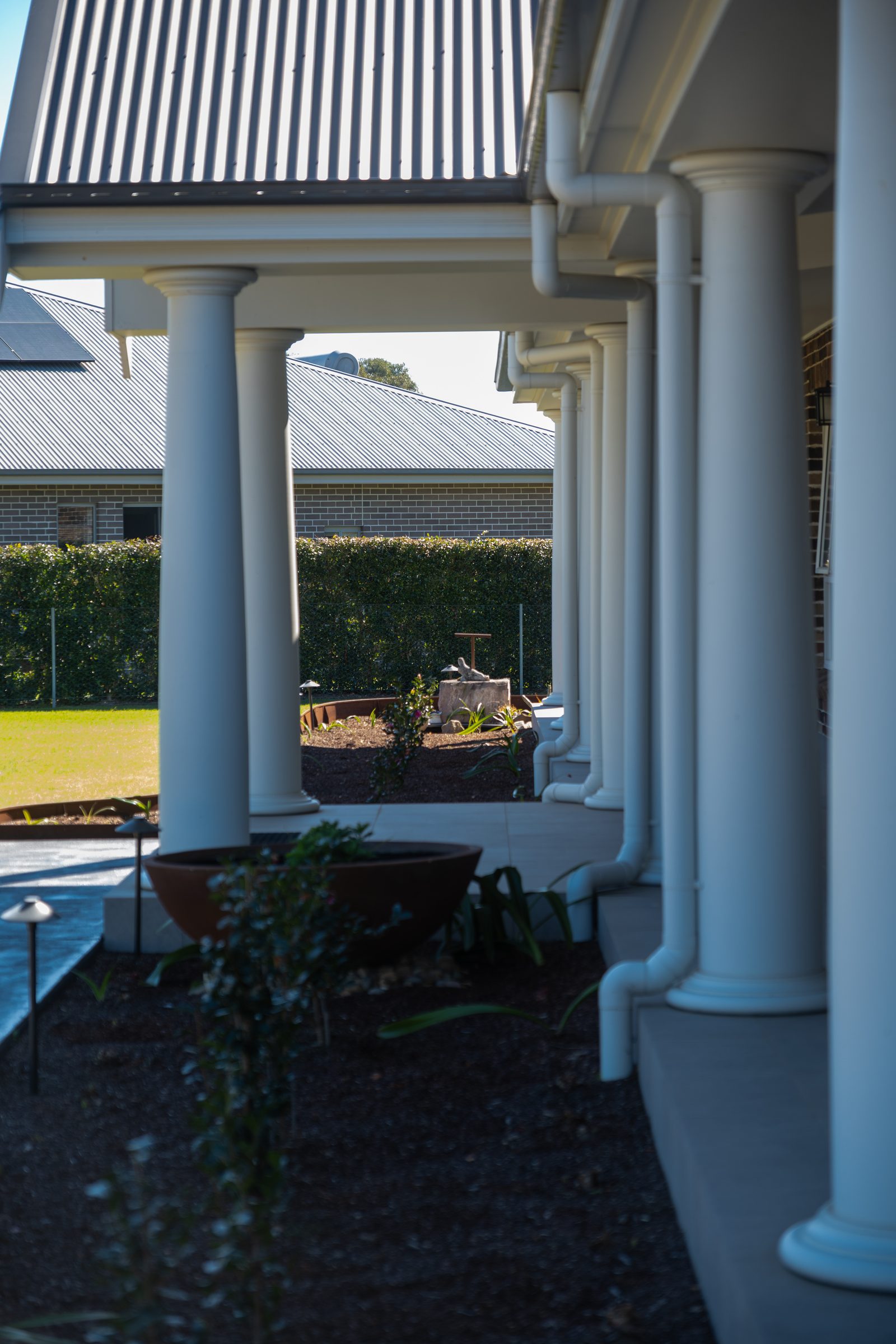 Colonnade and pool at a completed home