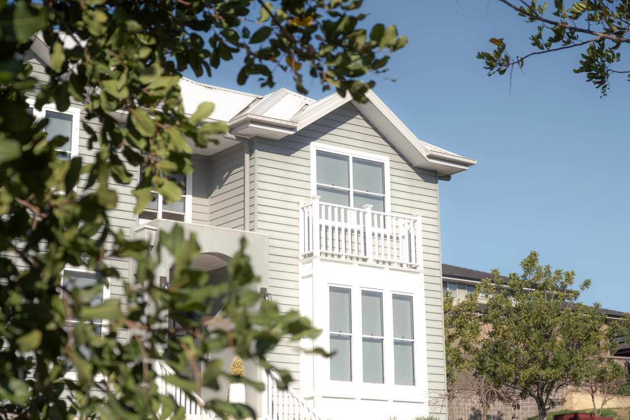 The upper storey through the trees